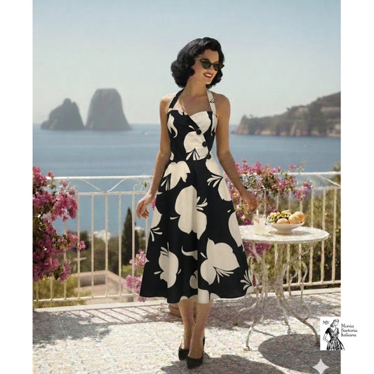 Abito in stile anni 50 con scollo a cuore e gonna mezza ruota in cotone fantasia astratta bianco nero. Modella e scenario realizzato con ia 